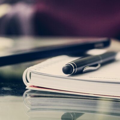 black pen on a notebook